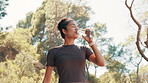 Athlete, woman and drink water for fitness for hydration, nutrition and training for workout break. Thirsty, female person and refreshing liquid for recovery, cardio exercise and wellness on mountain