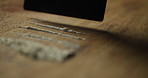 Credit card, cocaine and closeup with lines for addiction, substance and abuse at workplace. Powder, drugs and prepare with fentanyl, meth and opioid crisis with dust for illegal narcotics on desk