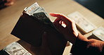 Hands, counting or dollars for illegal business, money laundering and investment scam in crime syndicate. Fraud, financial and closeup of criminal with bank notes for stealing, corruption and capital