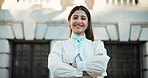 Face, arms crossed and happy businesswoman in city with confidence for career in real estate or property investment. Portrait, smile and professional outdoor with realtor, worker or employee in Spain