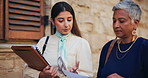 Women, lawyer or walking with documents for case preparation, testimony or court justice in city. Female people, attorney or talking with paperwork for legal law or proposal together in an urban town