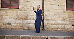 Smile, woman and dancing with earpods in city for listening to music, streaming audio and travel fun. Mature person, rhythm and moving with energy for playlist, morning commute and freedom of journey
