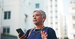 Mature woman, phone call or city with earphones for communication, discussion or conversation. Female person, consultant or employee talking with mobile smartphone for negotiation or chat in town