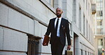 City, folder and walking with black man lawyer outdoor as legal council for court case or trial. Briefcase, buildings and travel with attorney at law downtown for commute to appointment as advocate