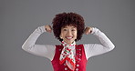 Happy, flexing and face of woman in studio with empowerment, feminism or motivation for champion. Smile, wink and portrait of female person with strength, confidence or pride by gray background.