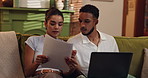 Couple, laptop and document for mortgage, expenses and financial planning or budgeting together on sofa at home. Man, woman and computer with finance, paperwork and bills discussion in living room 
