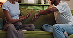 Couple, hands and argument with time, stress and drama at home or apartment living room. Anxiety, woman and man with dispute, angry and fight with toxic marriage and mistake or crisis with partner