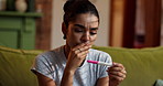 Home, woman and worry with pregnancy test, anxiety or disappointed with negative results or IVF fail. Stress, nervous and ovulation stick, bad news for female person and upset with infertility