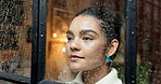 Thinking, woman and window with rain at home for reflection, loneliness and worry for storm phobia. Female person, thoughts and ideas of weather safety, remember past and anxiety of trauma experience