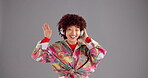 Woman, headphones and music with girl, dance and fun with energy and listen to radio on grey background. Tech, mockup space and dancer in studio with audio, streaming and techno sound for hobby