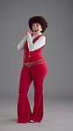 Face, fashion and happy woman with finger guns, studio and vintage style with space on gray background. Portrait, smile and gen z person with trendy clothes, pride and retro outfit for aesthetic