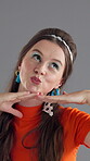 Face, woman and retro fashion with makeup in studio, fun and frame with hands for photography on gray background. Funky accessory, peace sign or pout with facial expression, playful and vintage style