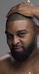African man, haircut and face in studio for grooming, smile or touch with pride by background. Person, model and happy for fade, hairstyle and confident with texture, shirtless or portrait in Nigeria