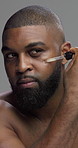 Studio, grooming and man with serum, skincare and self care with facial treatment, shine and morning. Gray background, routine and black person with oil for glow, dermatology and cosmetics for face