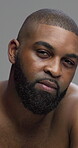 Studio, black man and face with skincare for hygiene, grooming and beauty with cosmetics treatment. Portrait, male person and model with dermatology for self care, glow with shine and gray background