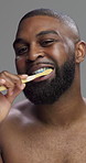 Studio, black man and face with toothbrush for dental, cleaning and oral care with morning routine. Portrait, male person and health with teeth whitening for hygiene, wellness and gray background