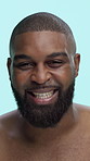 Face, laughing and black man in studio for skincare, beard or grooming with hygiene, treatment or natural cosmetics. Beauty, happy or funny model with facial hair or dermatology on blue background
