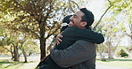 Headphones, friends and people in park for fitness, exercise and training together. Happy, greeting and man and woman hug outdoor with headphones to workout for wellness, health and challenge