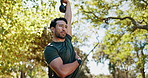 Fitness, man and kettlebell exercise at park for muscle strength, core stability or athletic performance. Low angle, bodybuilder and weightlifting in nature for endurance challenge, power or wellness