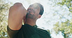 Fitness, man and outdoor with massage for neck pain, sport injury and muscle tension. Low angle, runner and sprain in back with discomfort, stiffness and stretching in nature for strain relief