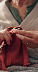 Hands, home and knitting with senior woman, hobby and relax with retirement, break and leisure. Closeup, pensioner and elderly person with creativity, wool material or technique with handmade clothes