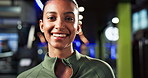 Face, woman and confidence in gym for fitness, personal trainer or instructor for exercise and health. Pride, happiness and professional coach for sports, athletes or wellness training with smile
