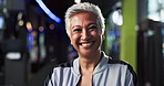 Mature, woman and face for fitness at gym, happiness and pride for healthy routine, workout and self care. Training, exercise and female person in portrait with smile, health and wellness at center