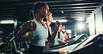 Woman, running and treadmill in gym for workout, athlete training and endurance for health. Cardio, exercise equipment or machine with female runner, intense and action for wellness at fitness center