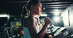 Woman, breathing and run on treadmill in gym for fitness, endurance and intense workout with sweating. Race training, practice or serious female runner with machine, exercise and cardio at club