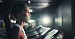 Woman, energy and run on treadmill in gym for exercise, endurance and intense workout with sweating. Race training, serious practice or female runner breathing on machine, fitness and cardio at club