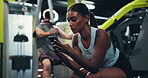 Fitness, gym and woman relax with phone for exercise schedule, track health and scroll online. Mobile, break and bodybuilder in sports club for wellness app, training progress and typing text message