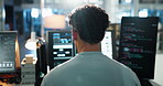 Man, computer and screen with developer coding in office for programming, system update and testing. Back, person and pc for software development, backend script and troubleshooting of app innovation