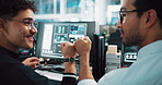 Men, developer and fist bump with computer in office for programming, coding success and software update. People, online and celebration for website development, teamwork and launch of testing server