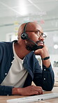 Office, black man and bored with headset for call center, crm feedback and agent for customer service. Thinking, male person and business consultant with keyboard for typing, sales help and tired