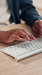 Hands, business and man with keyboard, typing and internet with copywriting, creativity and research for article. Closeup, person or journalist in office, computer and report with feedback and review