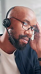 Stress, frustrated and black man in call center with fatigue, burnout and headache for lead generation in office. Telemarketing, tired and virtual sales consultant in headset with migraine at desk