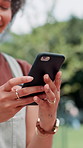 Phone, nature and hands of woman in park with social media, connectivity or contact online. Closeup, technology and female person with cellphone for networking, communication or mobile app outdoor.