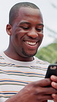 Phone, happy and black man in park with social media, connectivity or contact online. Laughing, technology and African male person with cellphone for networking, communication or mobile app outdoor.