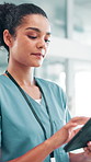 Nurse, walking and woman with tablet for healthcare report, telehealth and schedule in hospital. Technology, happy medical professional and reading records, wellness app or scroll email in clinic