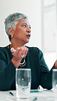 Meeting, discussion and mature businesswoman in office for review on magazine publishing advice. Conversation, manager and female executive editor with feedback for creative project in workplace.