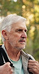 Hiking, senior man and happy in forest for travel adventure, explore nature and fresh air. Trekking journey, person and backpack in wilderness with sightseeing, tourism hobby and retirement wellness