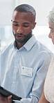 Healthcare, doctor and man with patient, tablet and explaining results of test, review and talking. Hospital, medical professional and people with tech for digital records, conversation and diagnosis