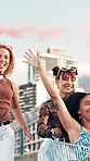 Women, friends and flare with shopping cart in city with adventure, playful and trendy fashion in street. Gen z people, girl and happy with trolley, game and smoke for color with streetwear in town