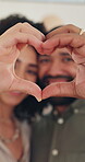 Home, couple and face with heart hands for love, commitment and romantic relationship with support. House, man and woman in portrait for emoji sign for connection, kindness and marriage with trust