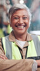 Arms crossed, face and funny with woman in warehouse for distribution, shipping or supply chain. Industry, logistics and stock with mature postal worker laughing in depot for freight or packaging