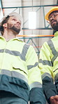 Businessmen, contractor or walking in storage at warehouse for logistics, distribution or inspection. Low angle, male people or employees with quality assurance or stock control below at supply depot