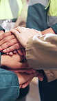 Business people, contractor and team with hands together at warehouse for distribution service or unity. Closeup, group or employees piling with mission for supply chain, trust or support at depot