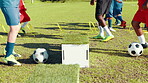 Sports field, kick and practice with soccer ball, legs and energy for fitness with sportswear and outdoor. Training, routine and kids with coach for skills, active and cardio for competition or match