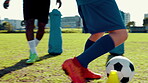Playing, soccer and feet with ball, kick and energy for training on sports field, competitive or match. Outdoor, people and active for game with sportswear, athlete and talent for football or fitness