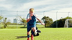 Child, running and practice for soccer outdoor with parachute, strength training and fitness exercise. Kid, equipment and sports workout for endurance, speed challenge and cardio with skill on field